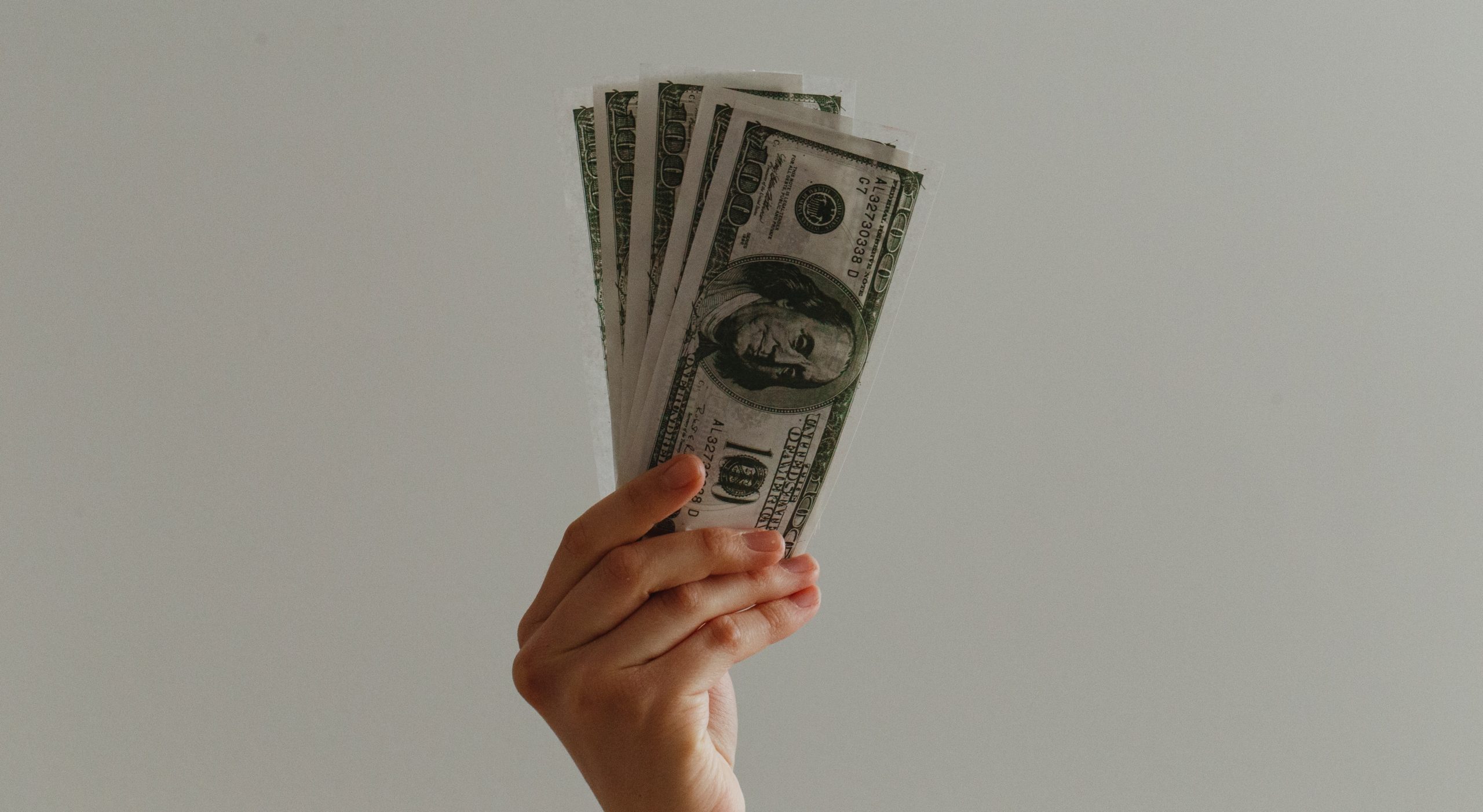 Hand holding money