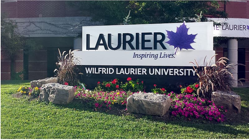 The main Wilfrid Laurier University campus sign in Waterloo, Ontario