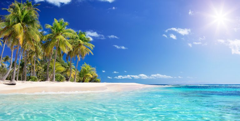 Tropical beach with sun shining