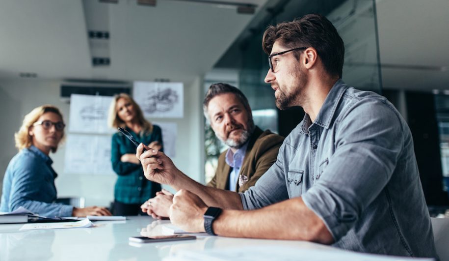 Man leading meeting