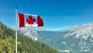 Canadian flag against mountains