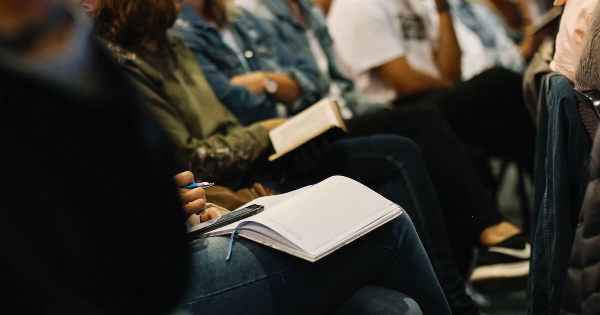 Students taking notes at seminar