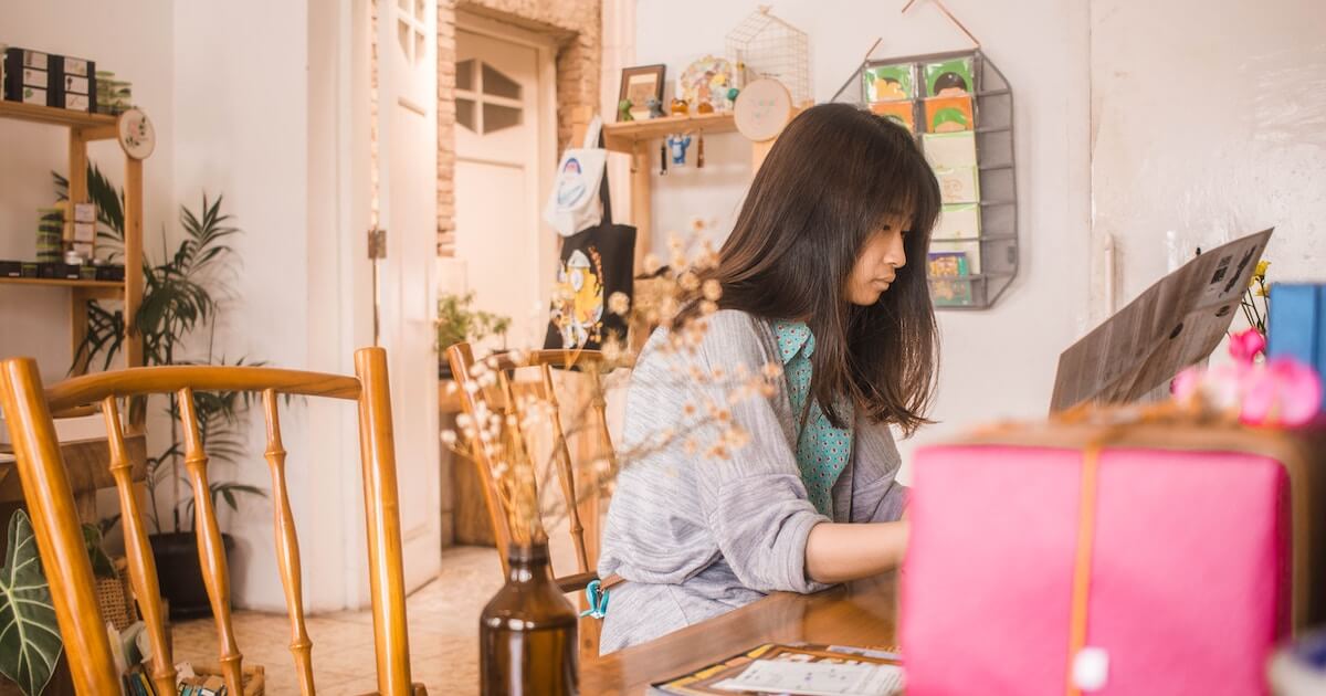 Student working at kitchen table