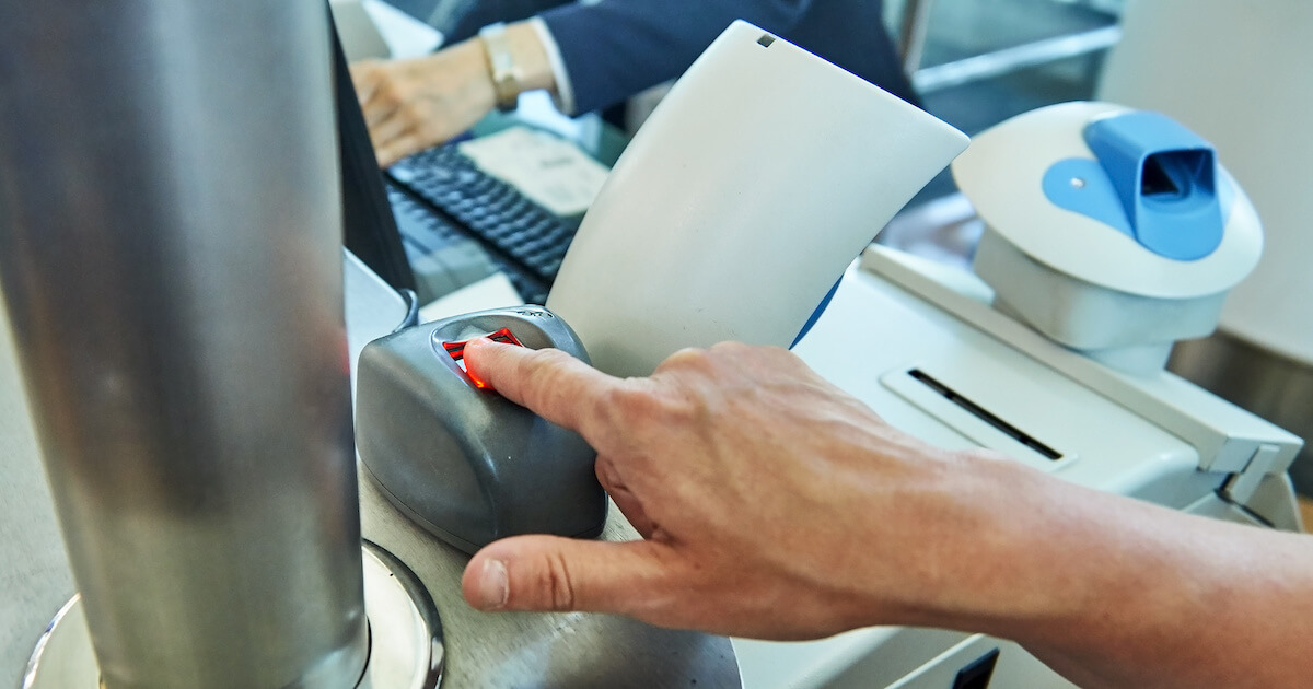 Man scanning fingerprint at checkpoint
