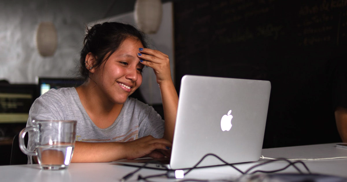 Frustrated woman at laptop