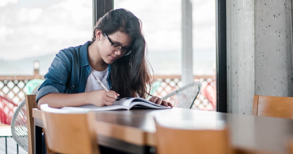Girl working in notebook