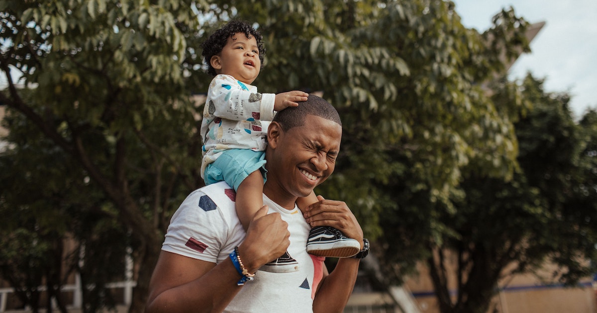 Man carrying his child