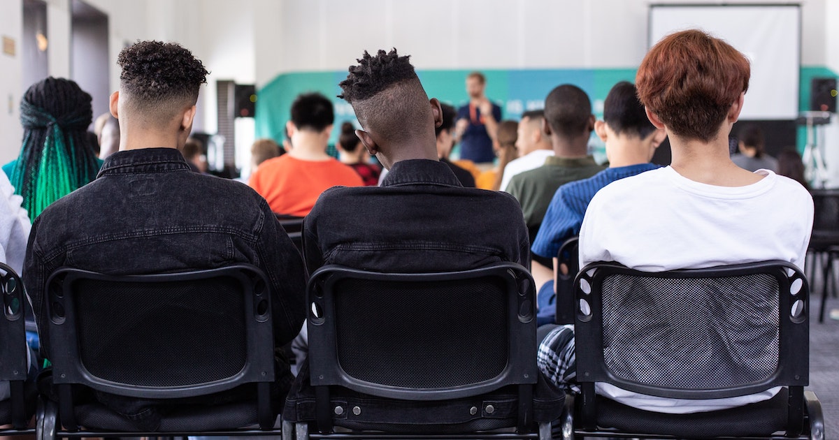 Students sitting in school presentation