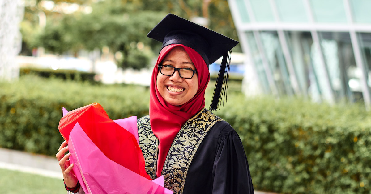 Woman in graduation cap and gown