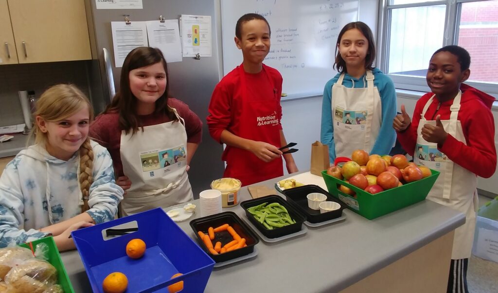 Young students with healthy food