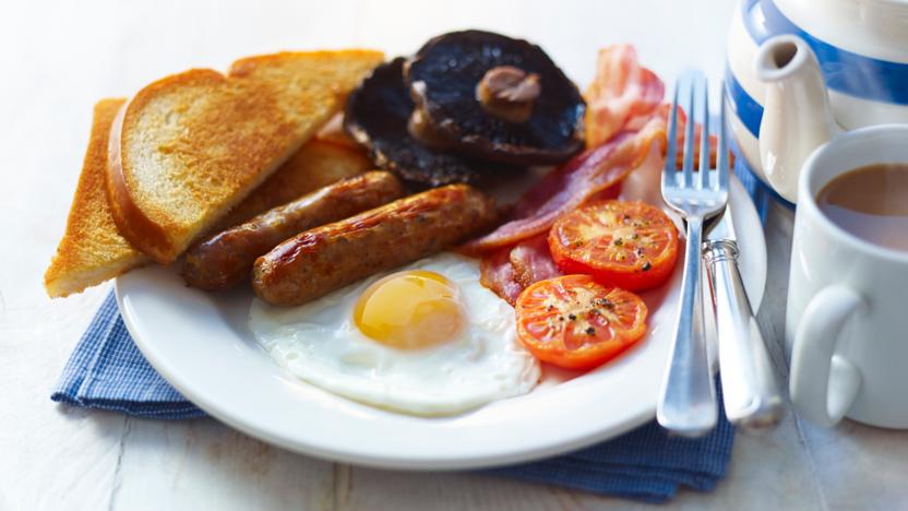 Plate with eggs, sausage, toast, tomatoes, and mushrooms