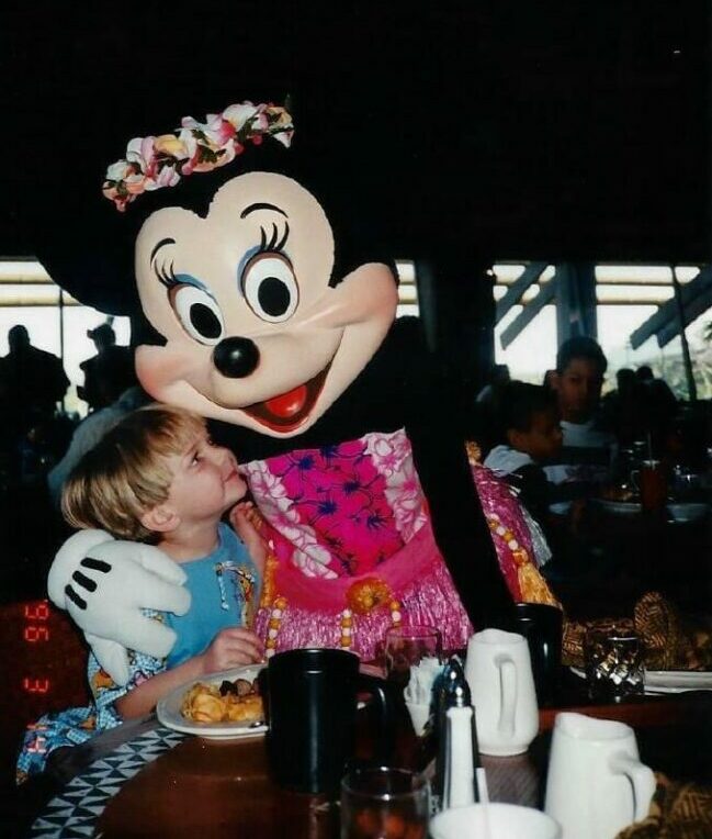 Team member posing with Minnie Moust
