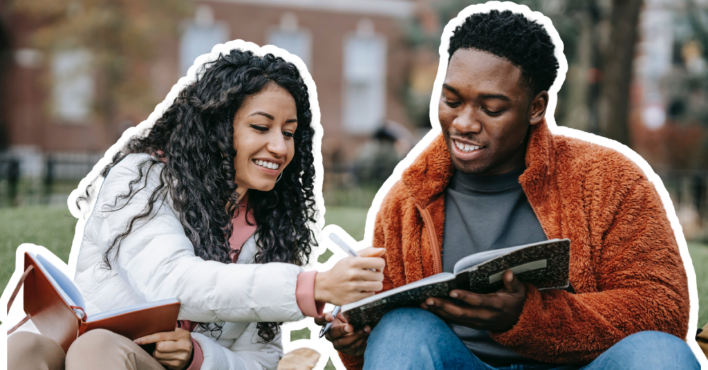 Two black international students on an American campus, reading about Black History Month.