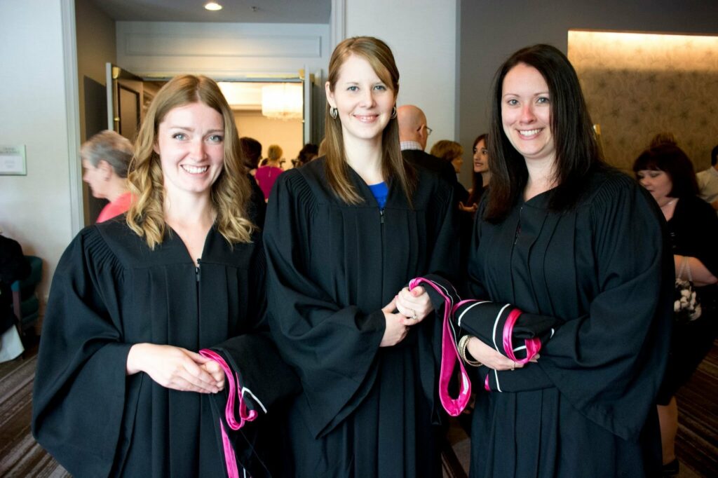 Photo of three Yorkville University graduates