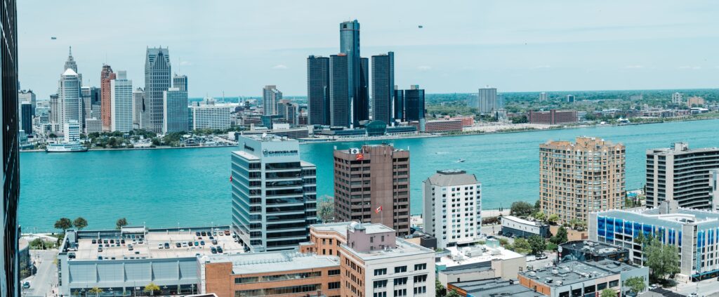Photo of the Windsor and Detroit skylines, looking from the Windsor side over the Detroit River.