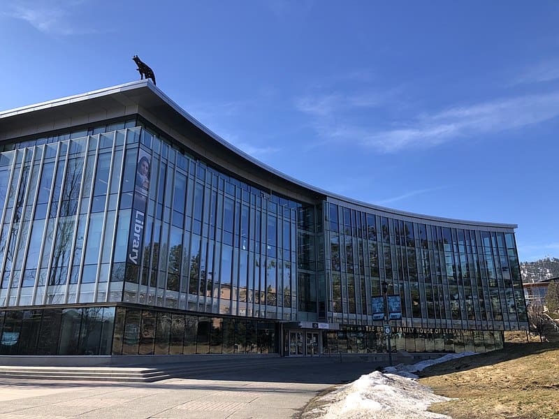 A new library building, made of glass and steel, on the Thompson Rivers University campus.