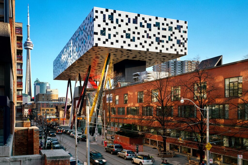 OCAD University (an impressive silver cube building towers over multistorey brick buildings in downtown Toronto.)