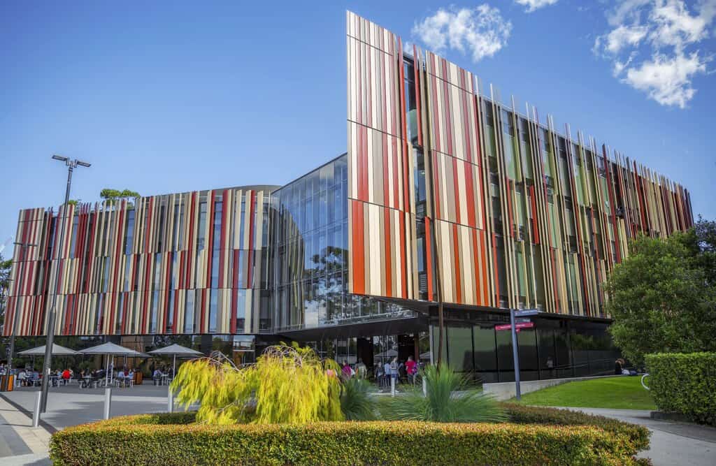 A large library with multicoloured walls (Macquarie University Library).