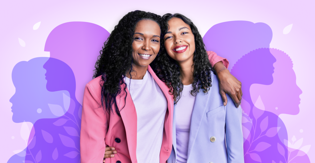 Two women with curly hair and pastel pink and purple blazers stand with their arms around each other's shoulders. They are framed by semi-transparent silhouettes, each of a different women's profile, in shades of purple.