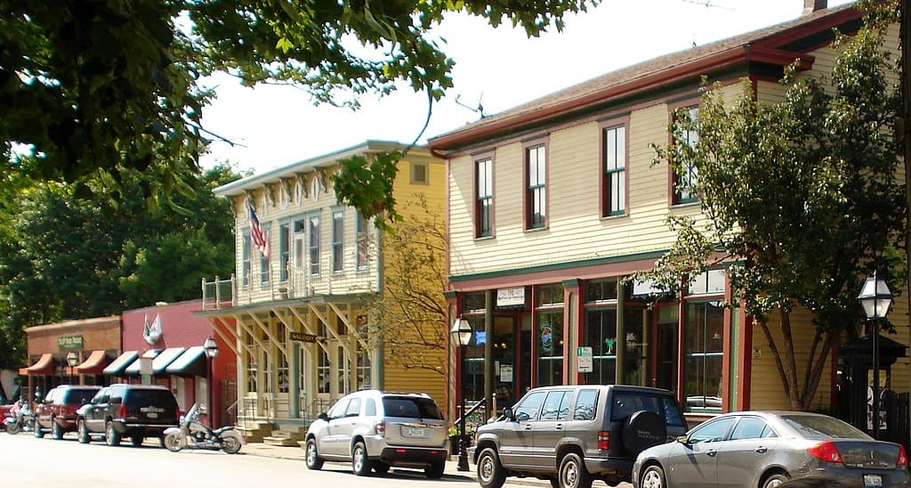 One- and two-storey brick buildings along a heritage main street in Davenport, Iowa.