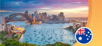 A photograph of an Australian landscape, with the flag of Australia on the bottom right corner.