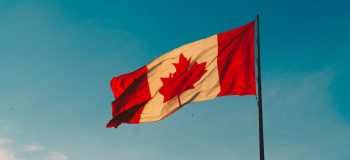 Canada flag against sky